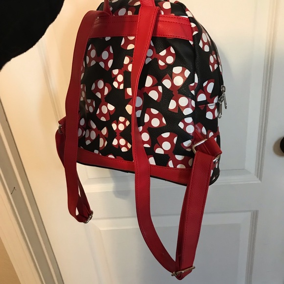 A beautiful Mini Disney Backpack with one packet outside. - Picture 9 of 9